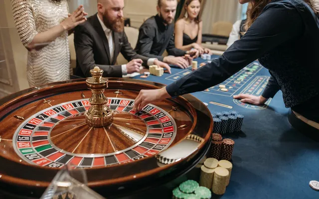 Croupier at a roulette wheel
