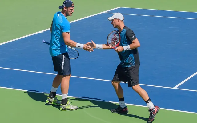Tennis ball and racket on court